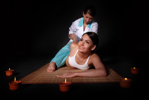 Beautiful girl having thai massage.